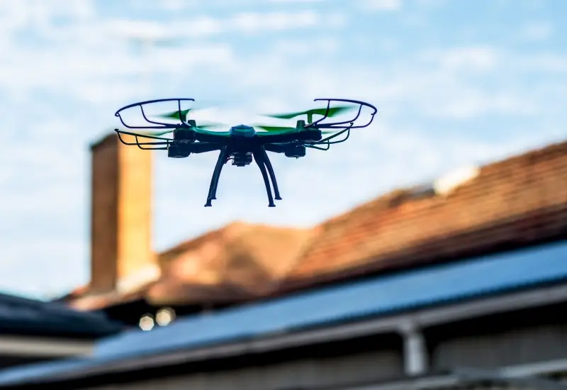 A drone assisting with a roofing inspection in Alabama or the Florida Panhandle